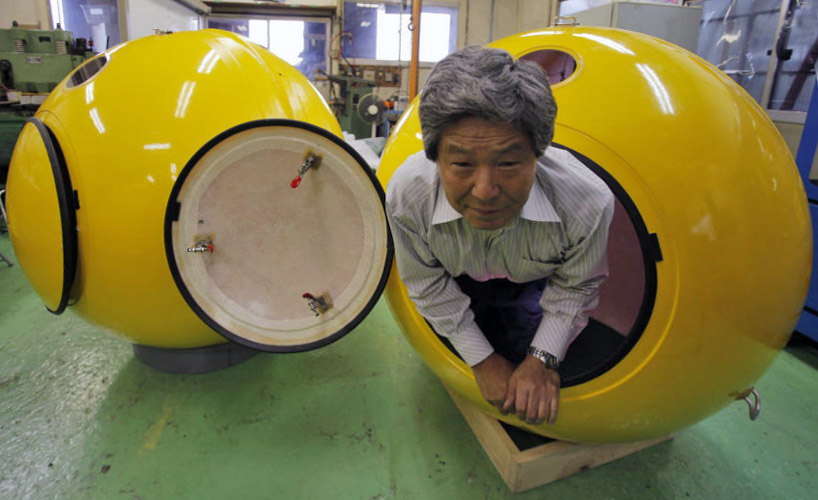 Noah escape pod is demonstrated by New Cosmo Power president Shoji Tanaka